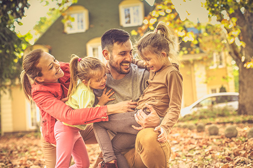 Happy family outdoors in autumn